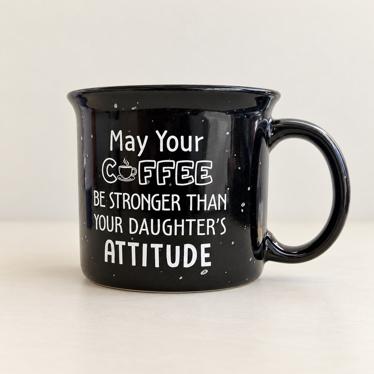 Black speckled coffee mug that reads May your coffee be stronger than your daughter's attitude